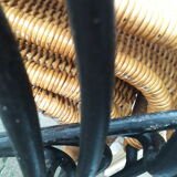 4 vintage wrought iron rattan chairs.
