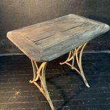 Ancient wrought iron and wood garden table