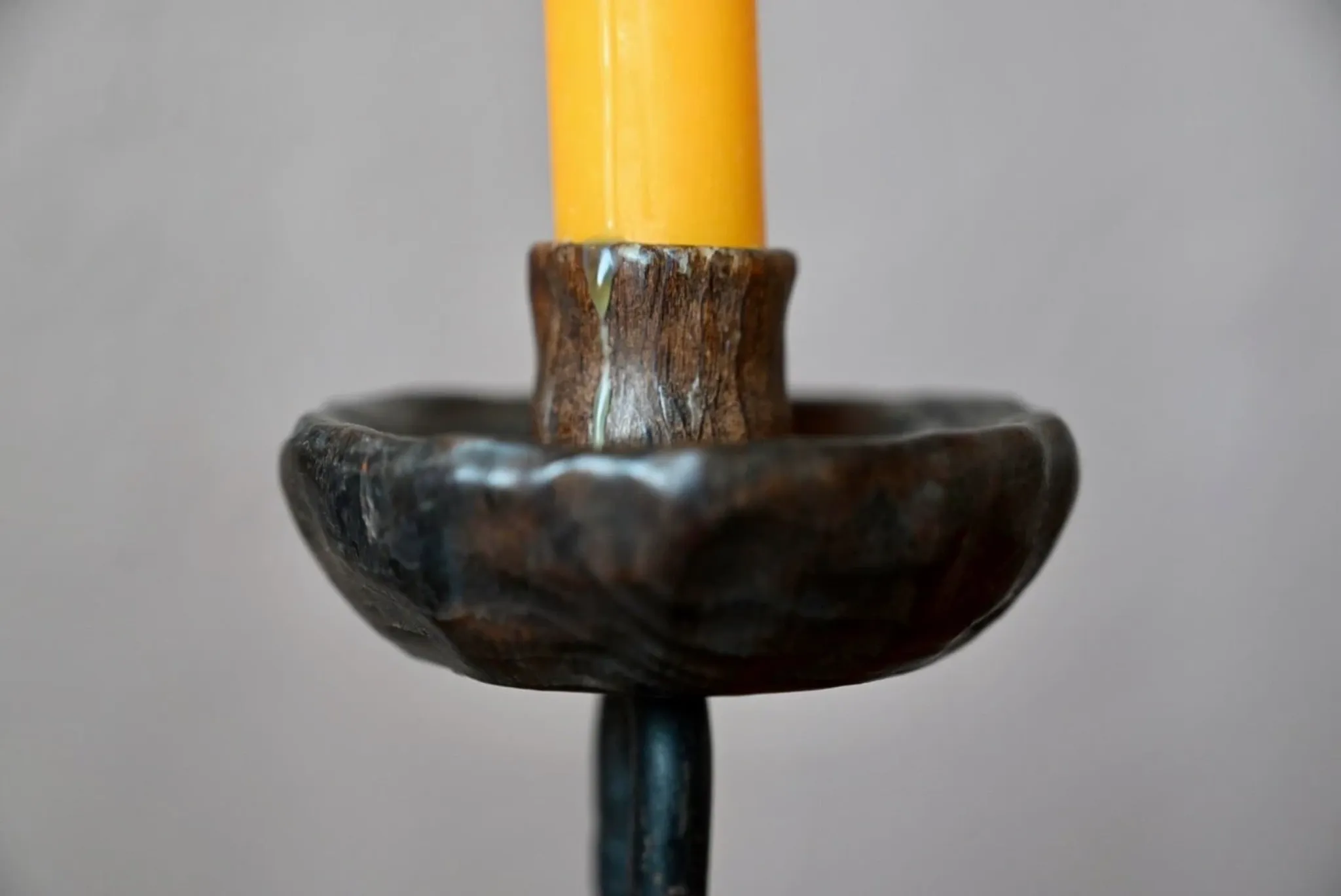 Sculpted wooden and wrought iron brutalist double chandelier from the 1960s.