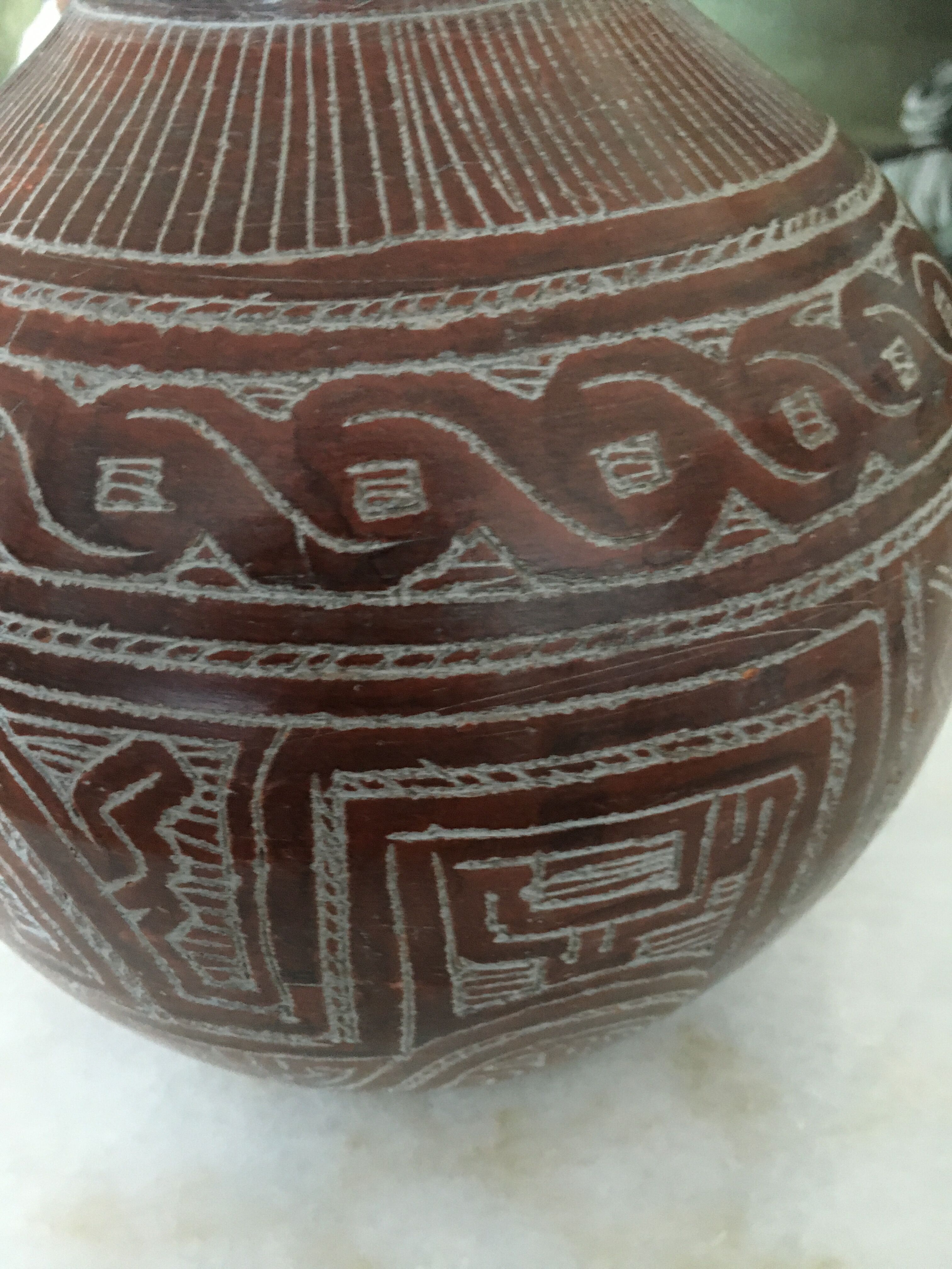 Vase in earth baked ethnic graphic patterns
