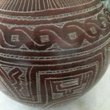 Vase in earth baked ethnic graphic patterns