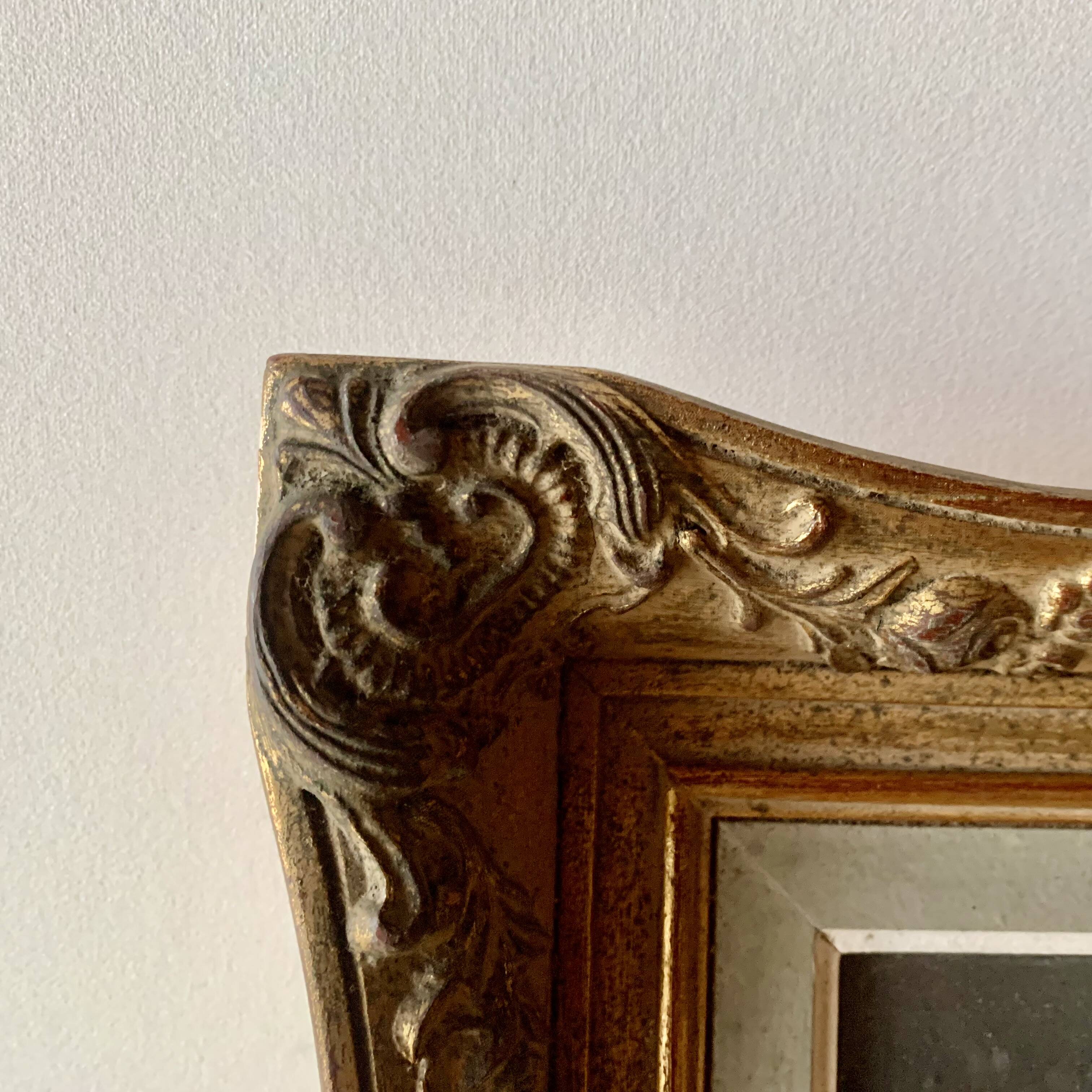 Old gilded carved wooden wall frame
