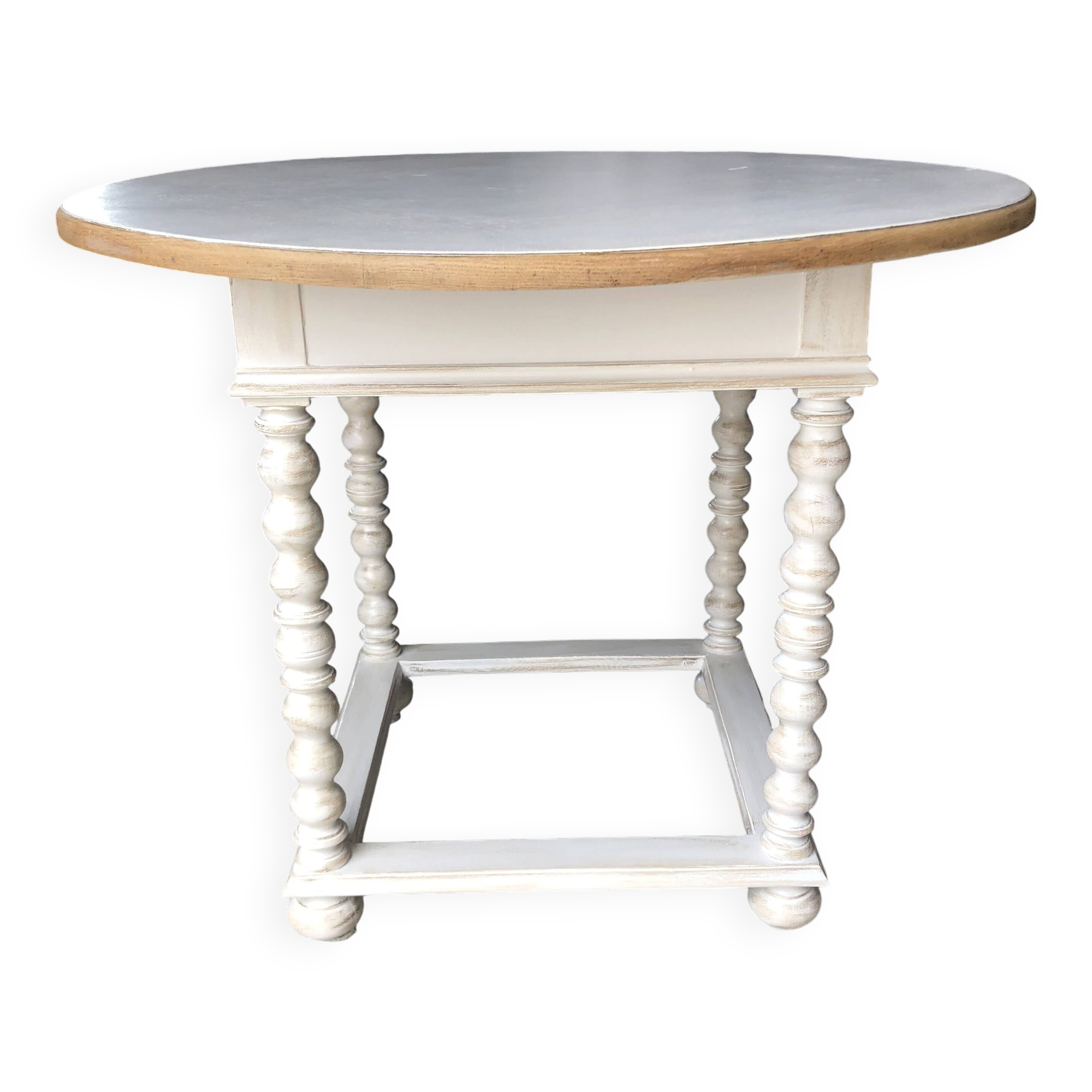 Antique round table refurbished in cerused white, with twisted legs.