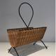 Rattan and black lacquered metal magazine rack