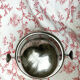 Antique silver sweetener with rolling lid