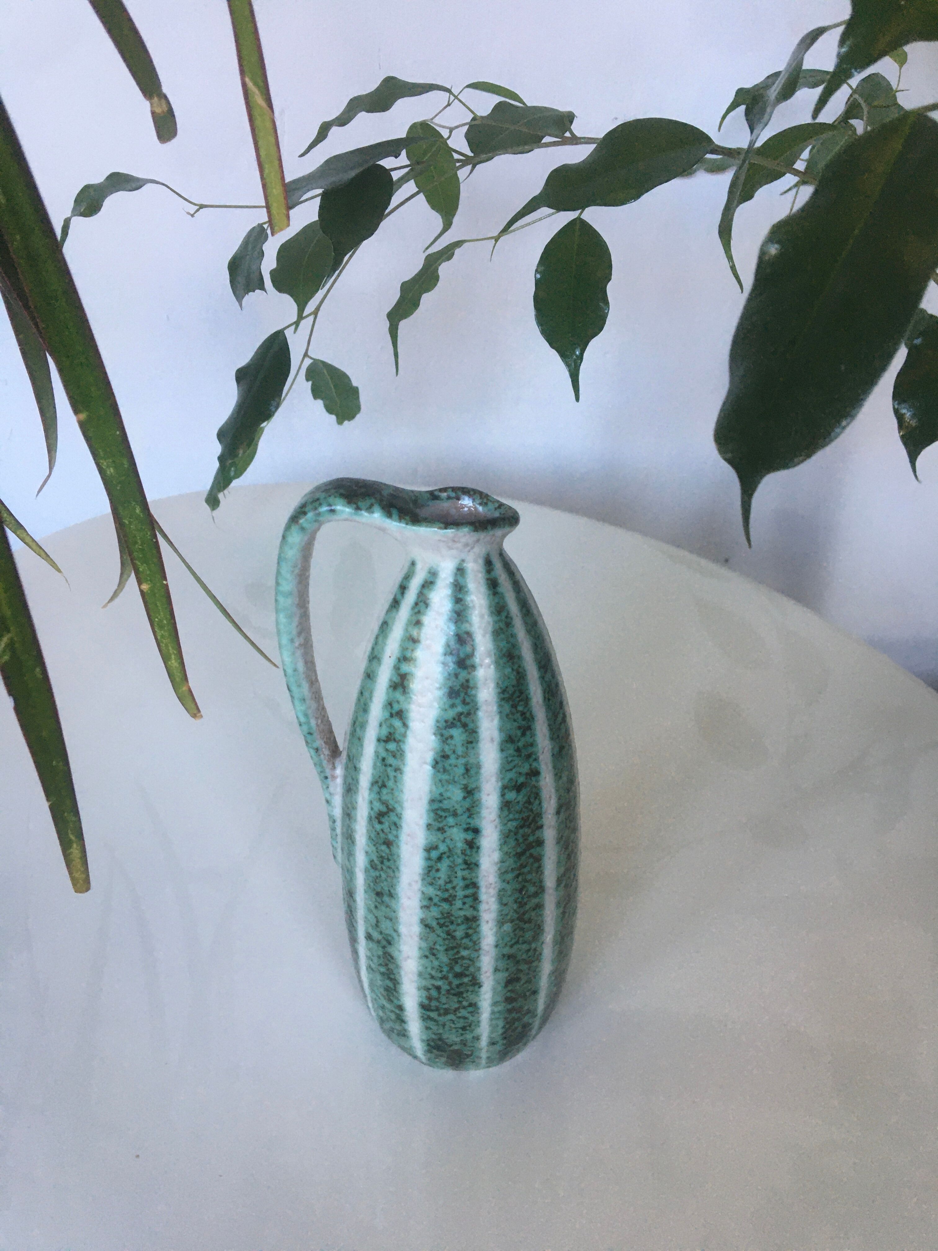 Signed and numbered art ceramics pitcher