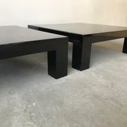 Pair of black laqué wood coffee tables, circa 1970.