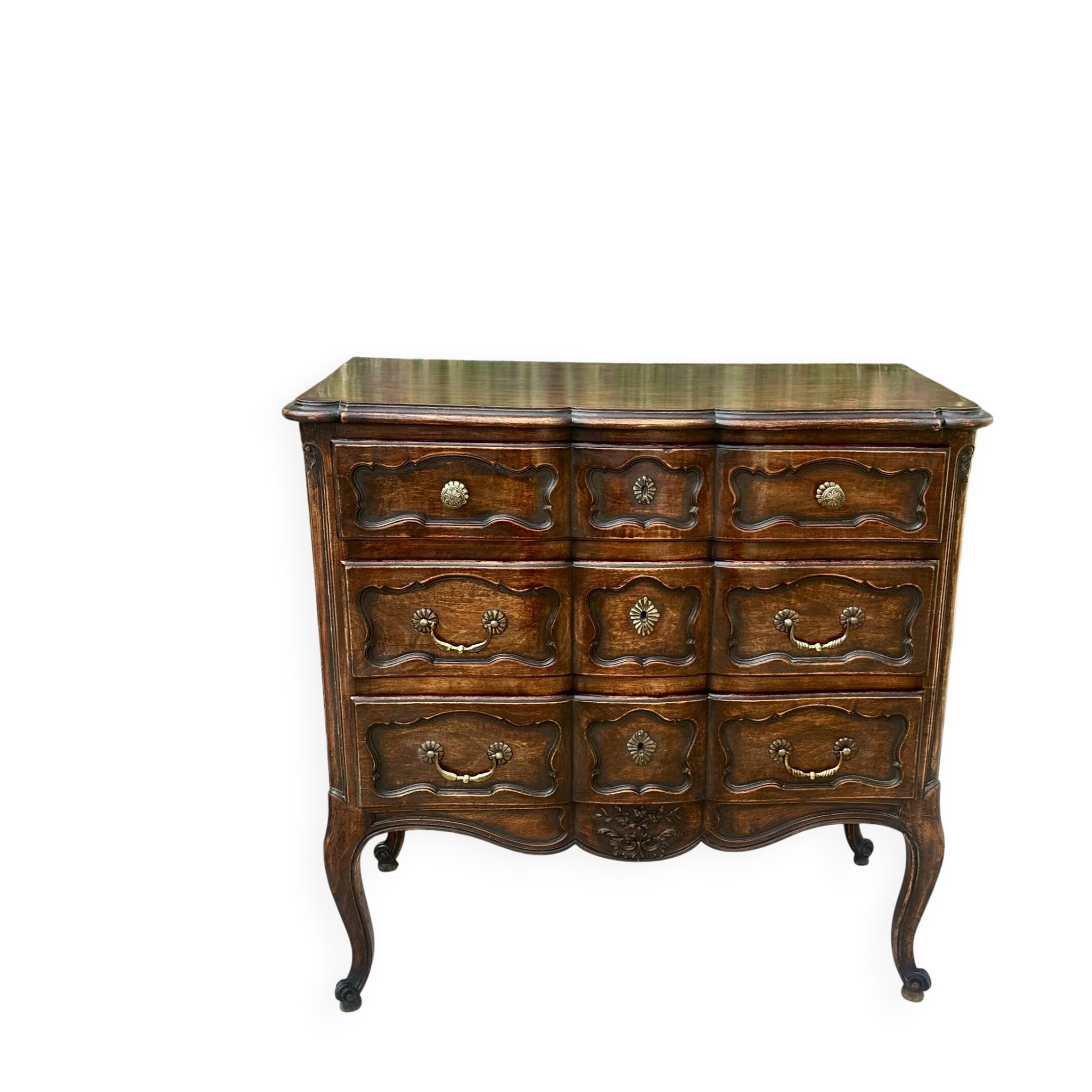 Carved and moulded solid wood commode in the Louis XV style.