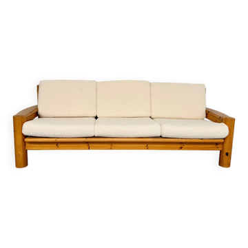 Solid pine canapé and boucle in 1970s Scandinavian design.