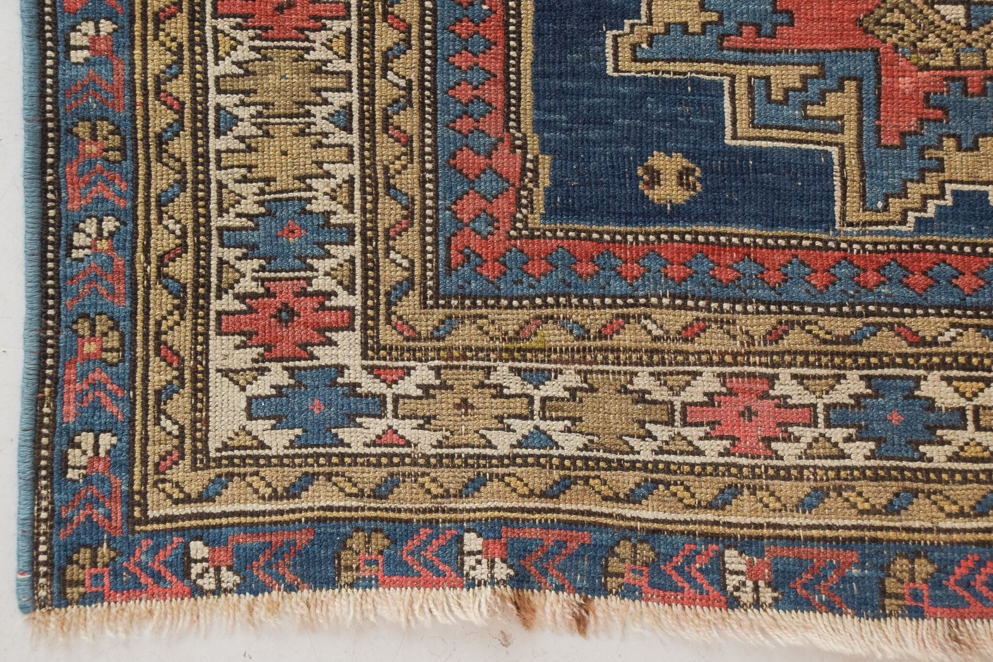 Handwoven blue ground persian rug with bird-like figures