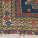 Handwoven blue ground persian rug with bird-like figures