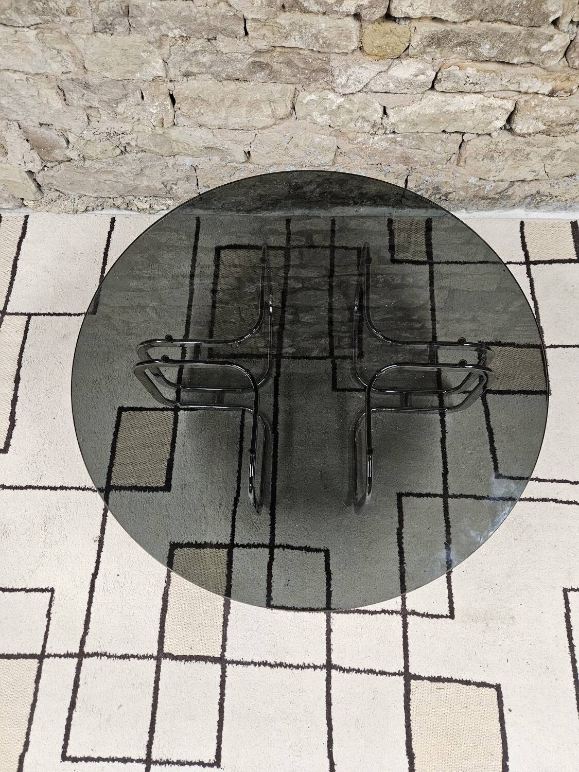 Round chrome coffee table with smoked glass