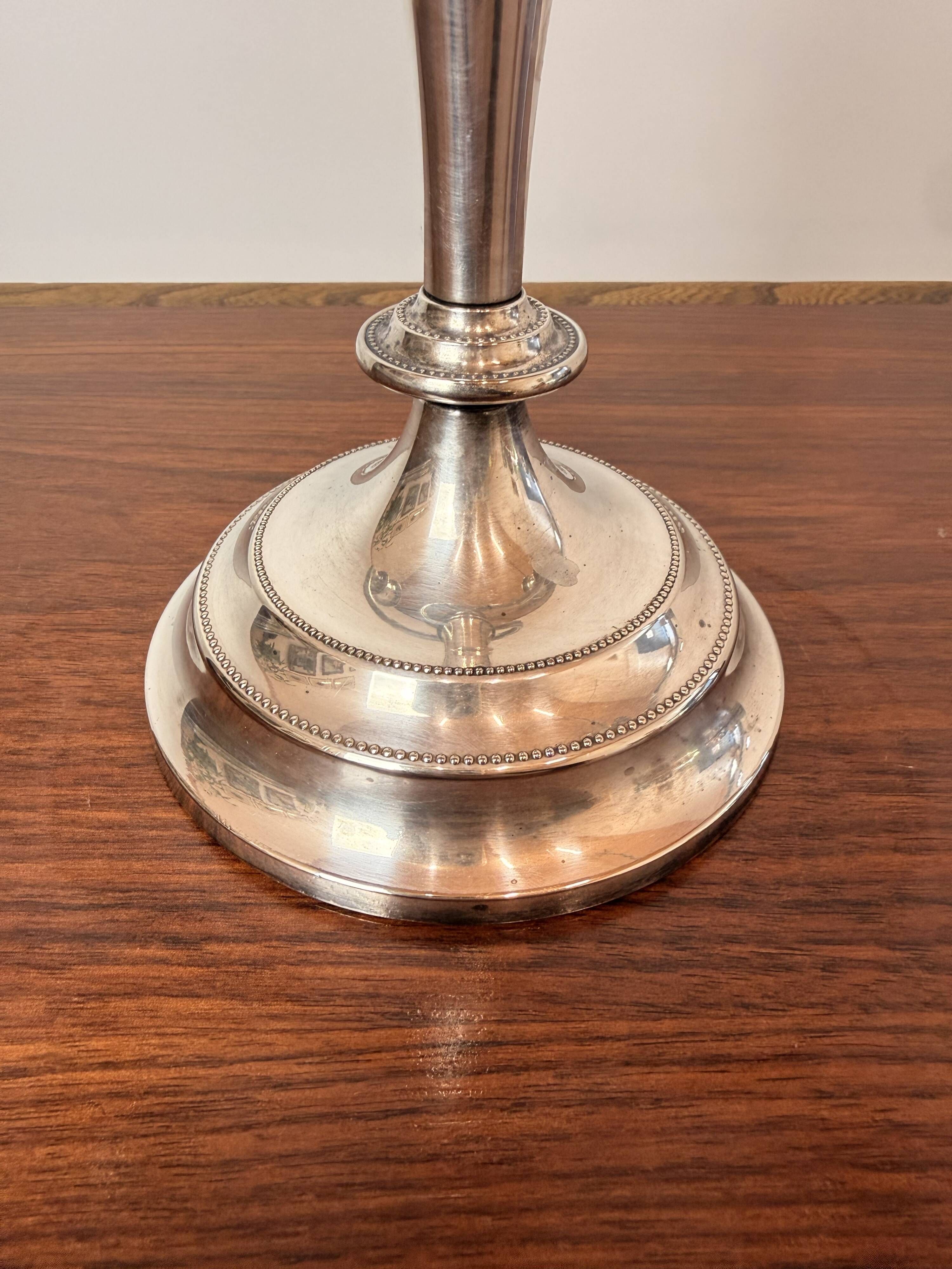Vintage twisted chandelier with three lights in silver-plated metal.