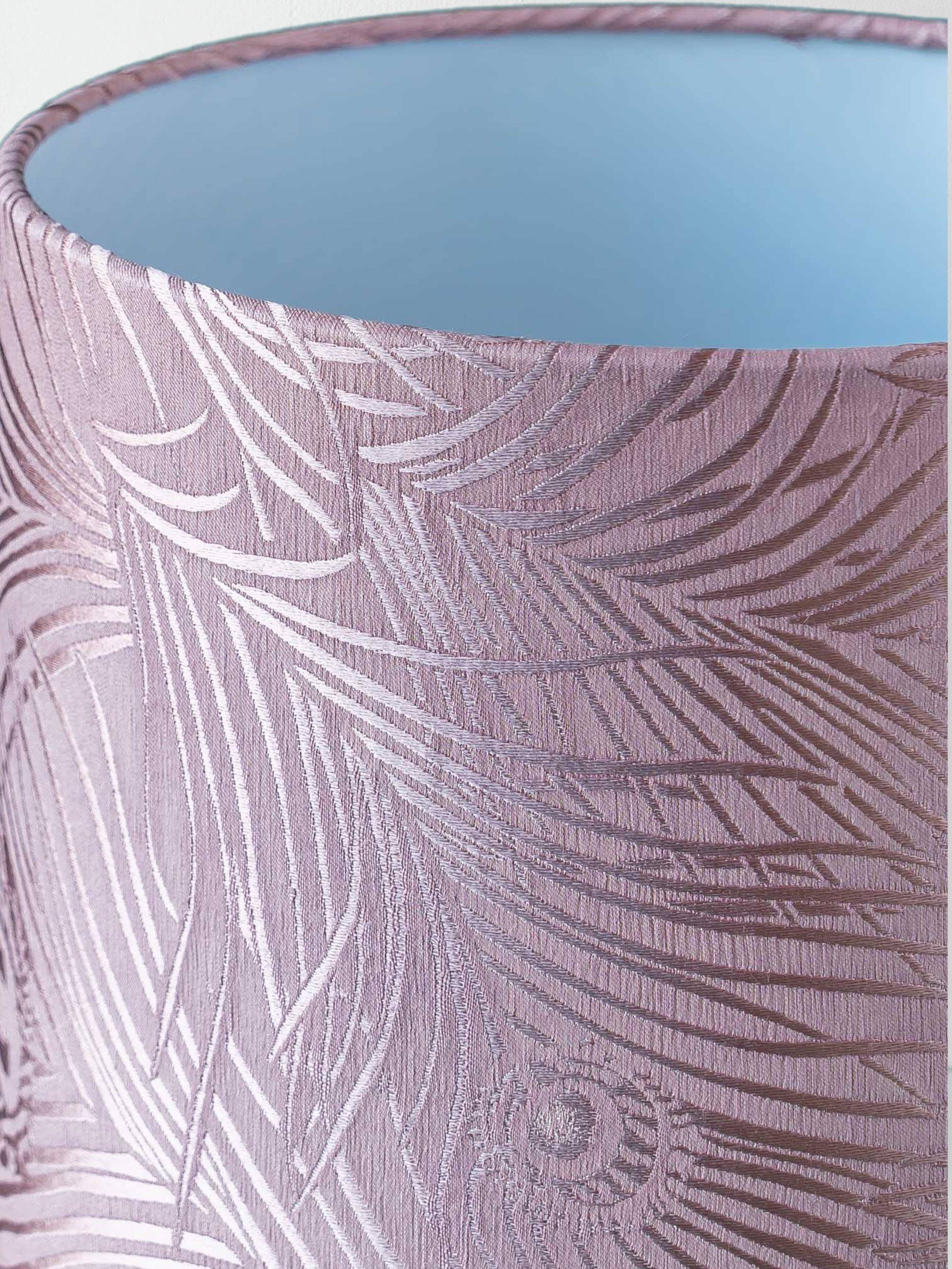 Royal Delft blue-green ceramic table lamp with pink jacquard peacock shade.