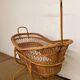 Rattan cradle on wheels