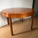 Extendable teak round table