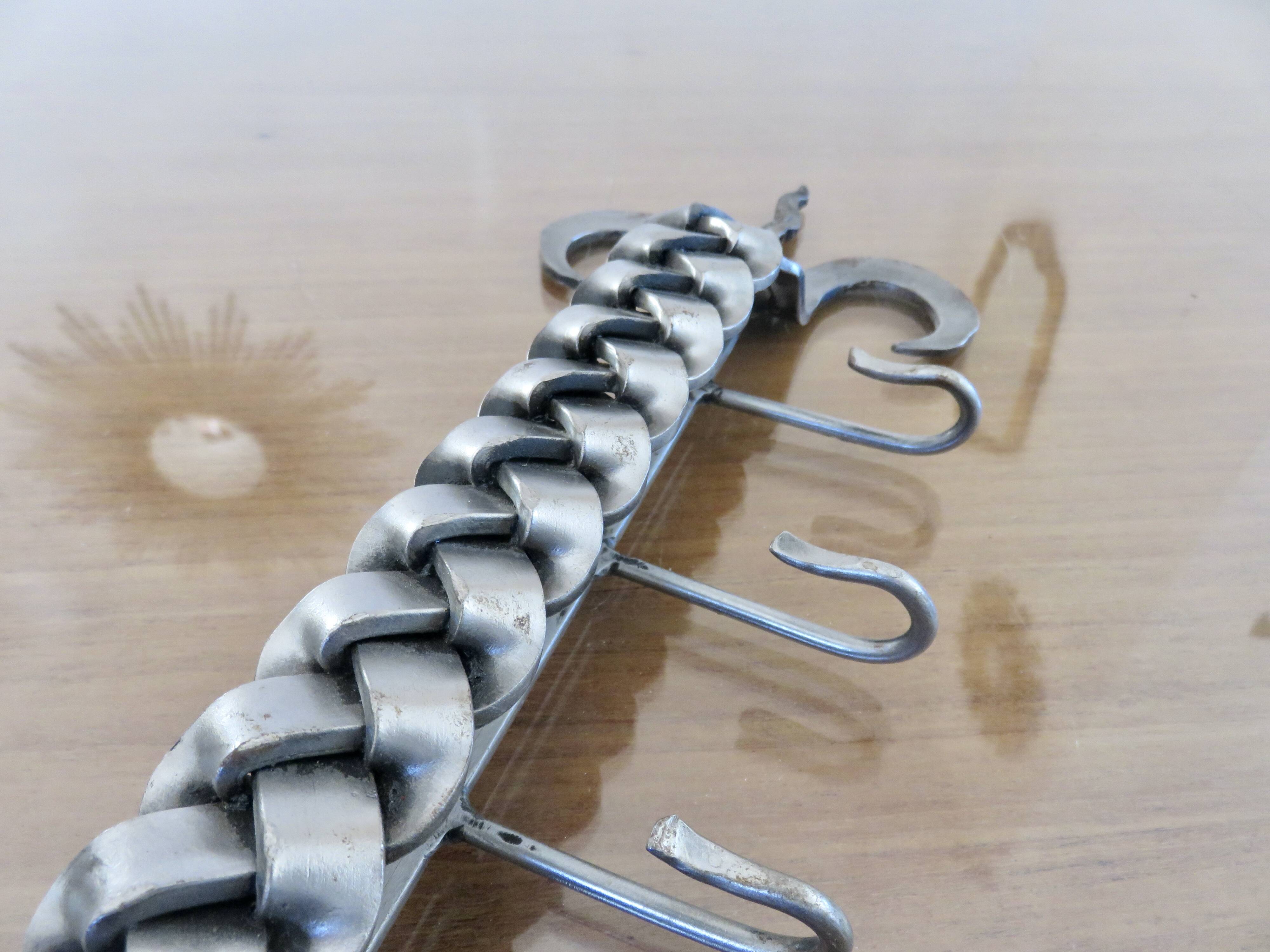 2 Tea towel holders, ironwork in braided raw steel, 1970