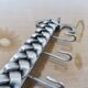 2 Tea towel holders, ironwork in braided raw steel, 1970