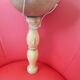 Large cup-and-ball cup in light wood.