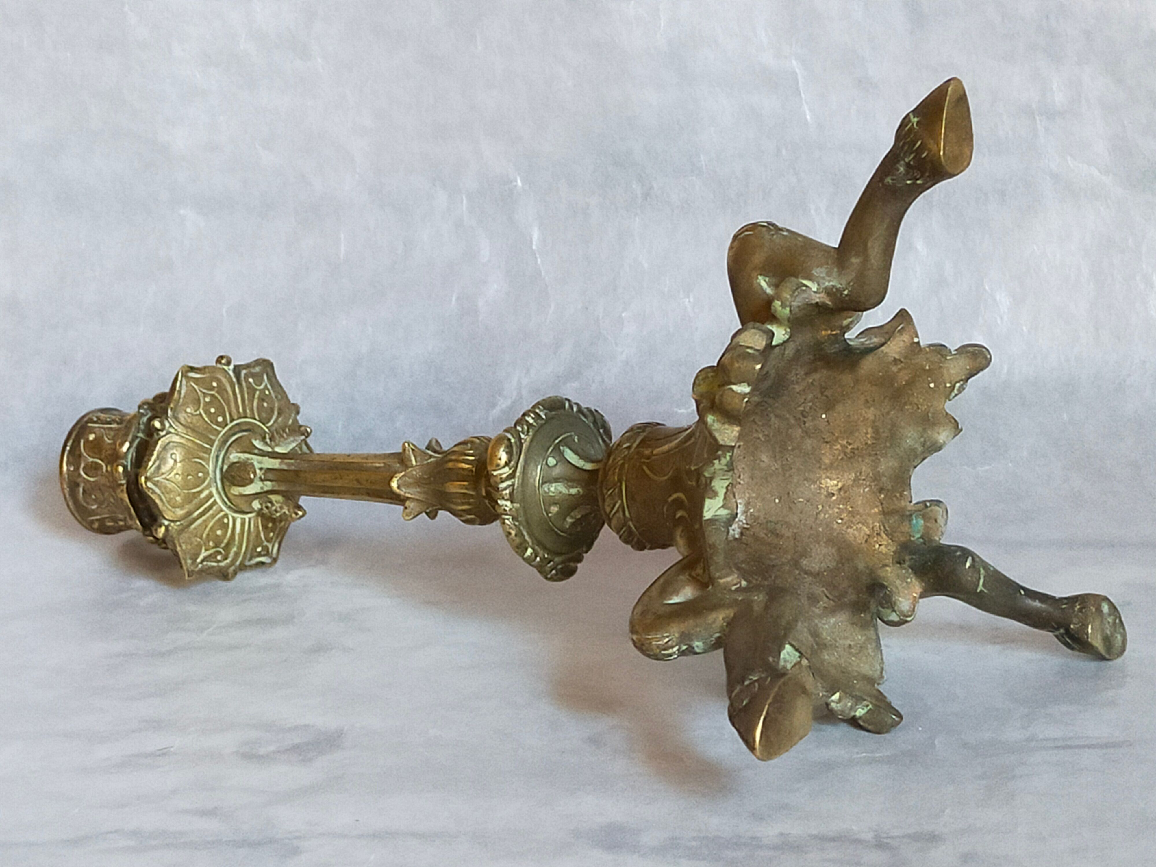 Candle holder in gilded bronze tripod nineteenth century