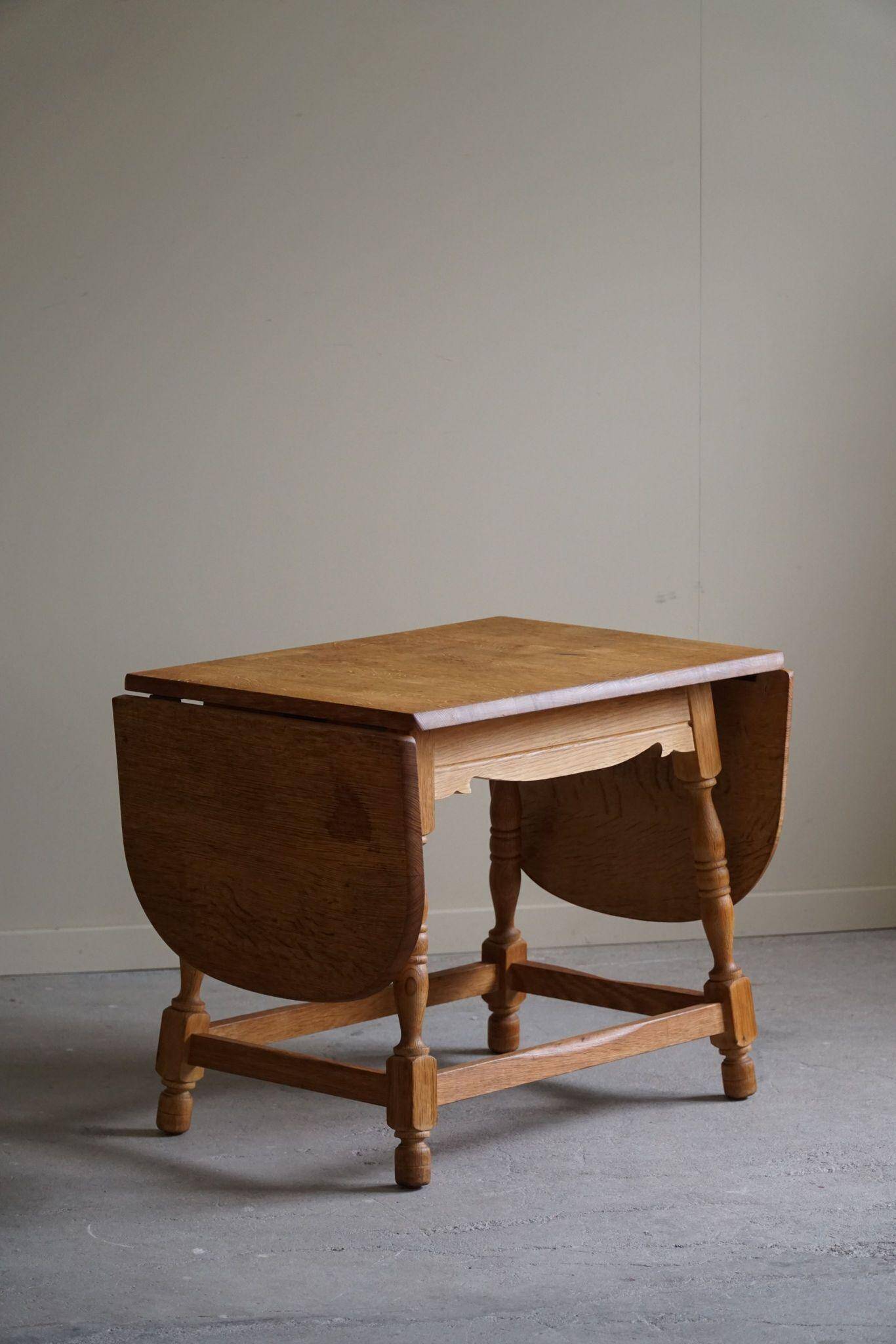 Danish mid-century folding side table in oak, Henning Kjærnulf, 1960s.