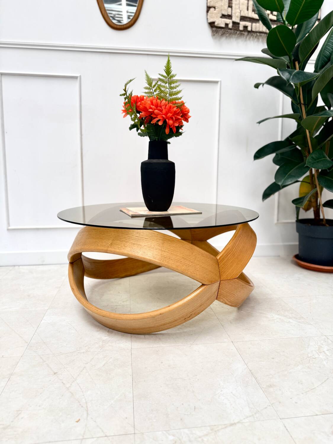 Smoked glass and curved wood coffee table