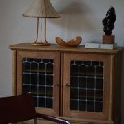 20th-century mid-century solid oak sideboard with glass front, by a Danish cabinetmaker.