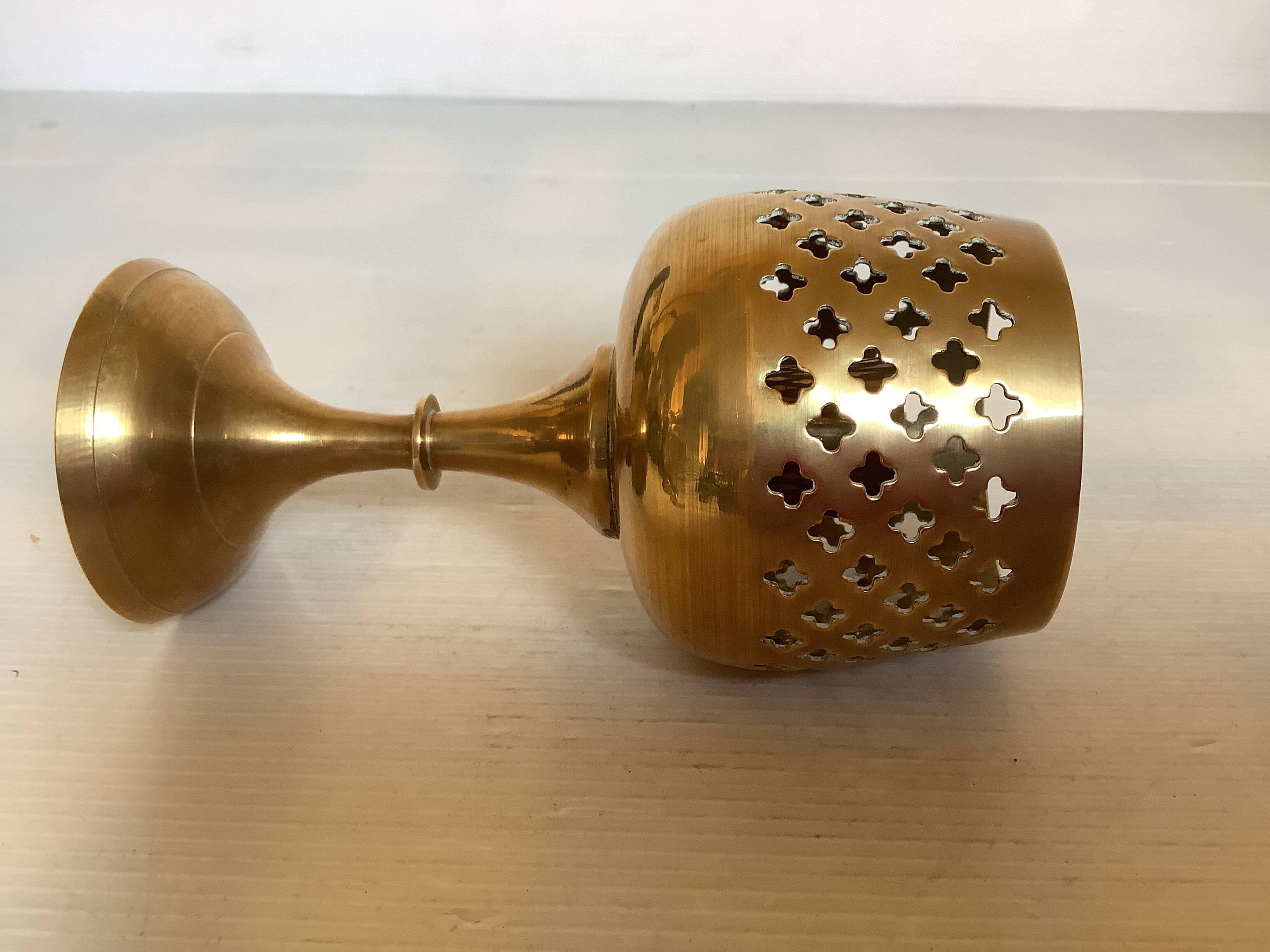 Lattice brass catchall and candlestick.