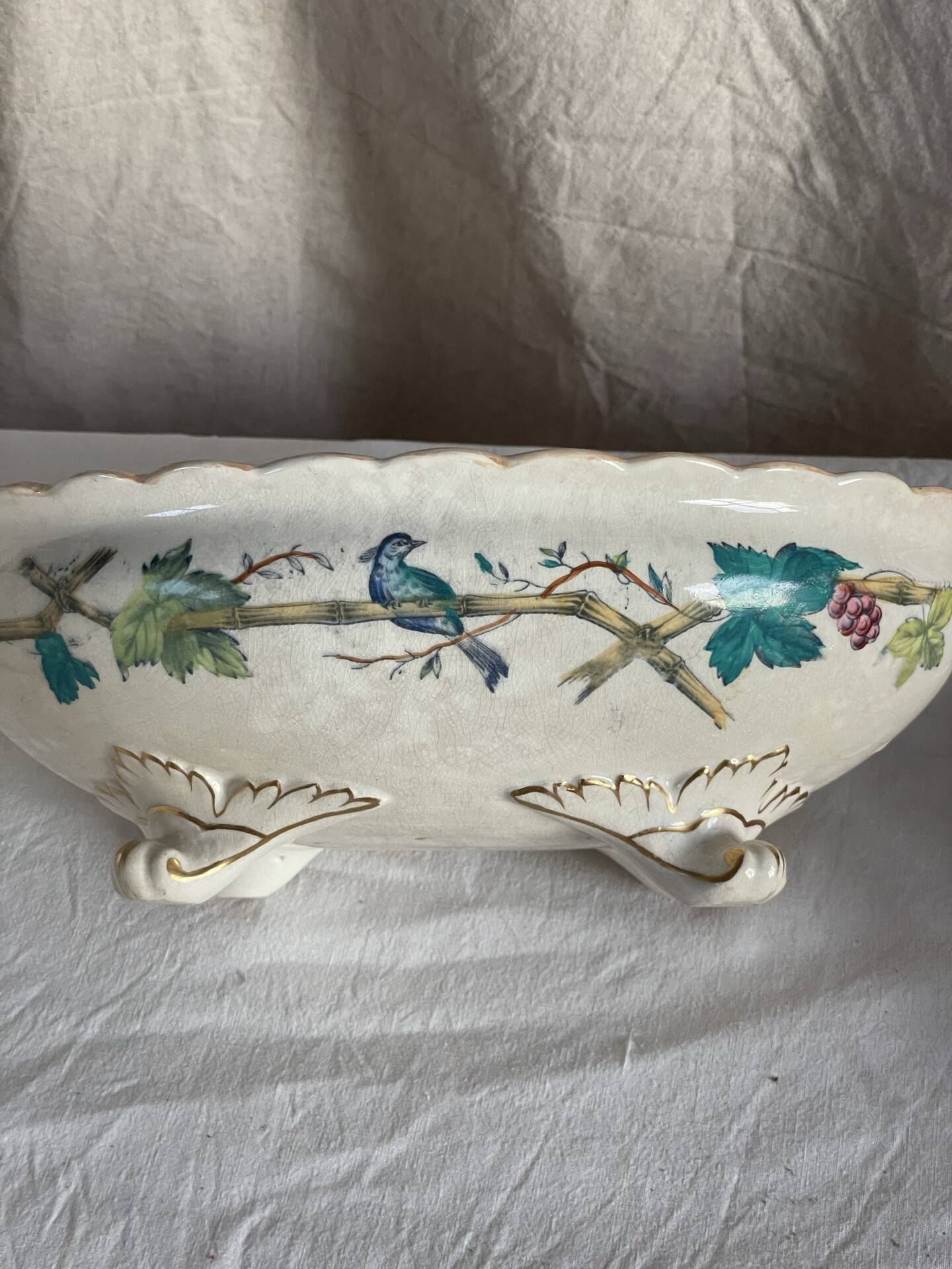 Oval jardinière in earthenware on legs with Japonese motif, birds, leaves.