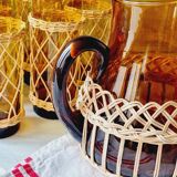 Carafe and glasses in blown amber glass and wicker