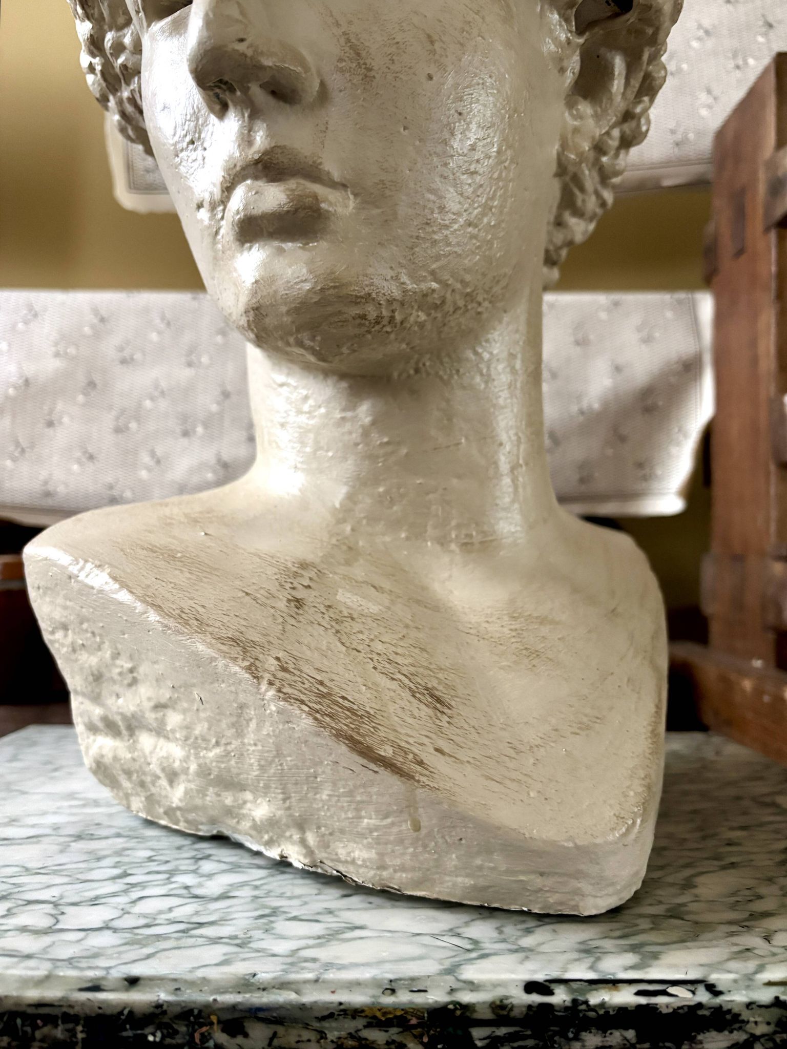 Concrete bust painted in beige - reproduction, detail of "The Dying Slave"