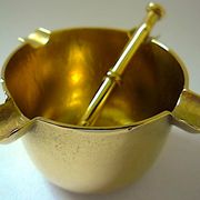 Three "vintage" bronze ashtrays with golden natural patina forming mortars with their drumsticks