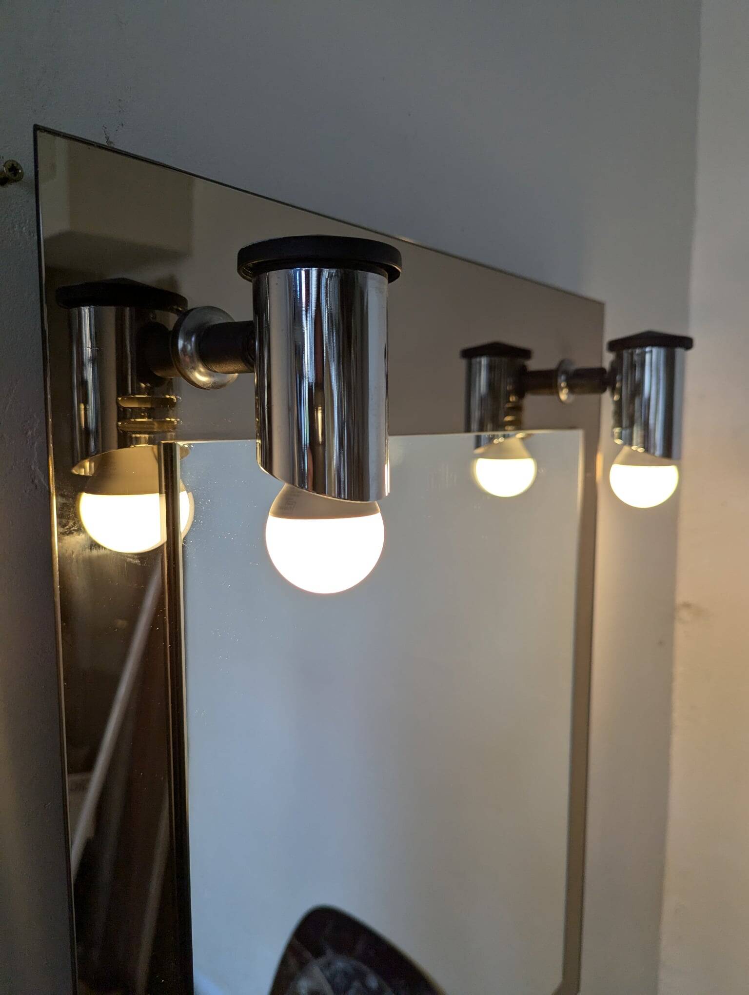 Vintage mirror with sconces.