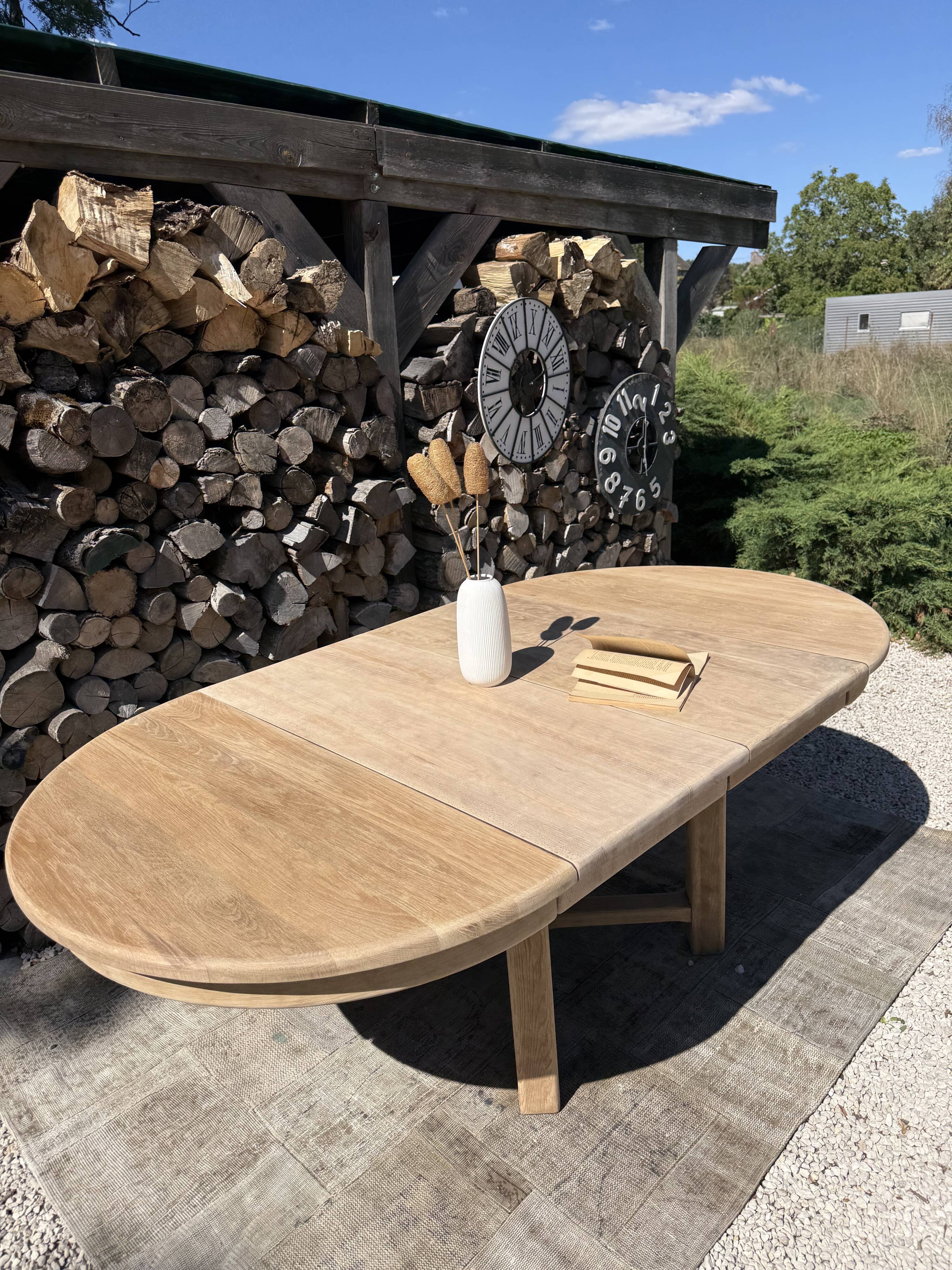 Round solid oak table with extensions, maximum 220cm.