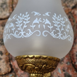 Pair of bronze wall lamps and frosted glass globe, early twentieth century.