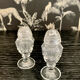 Duo of crystal salt shakers and pepper shakers