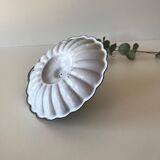 Candlestick in white enameled metal