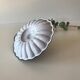 Candlestick in white enameled metal