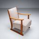 Oak armchair with curved armrests