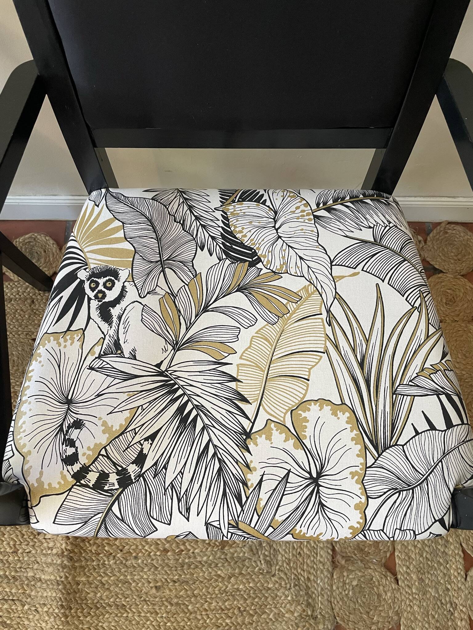 Black wooden armchair with golden leaves