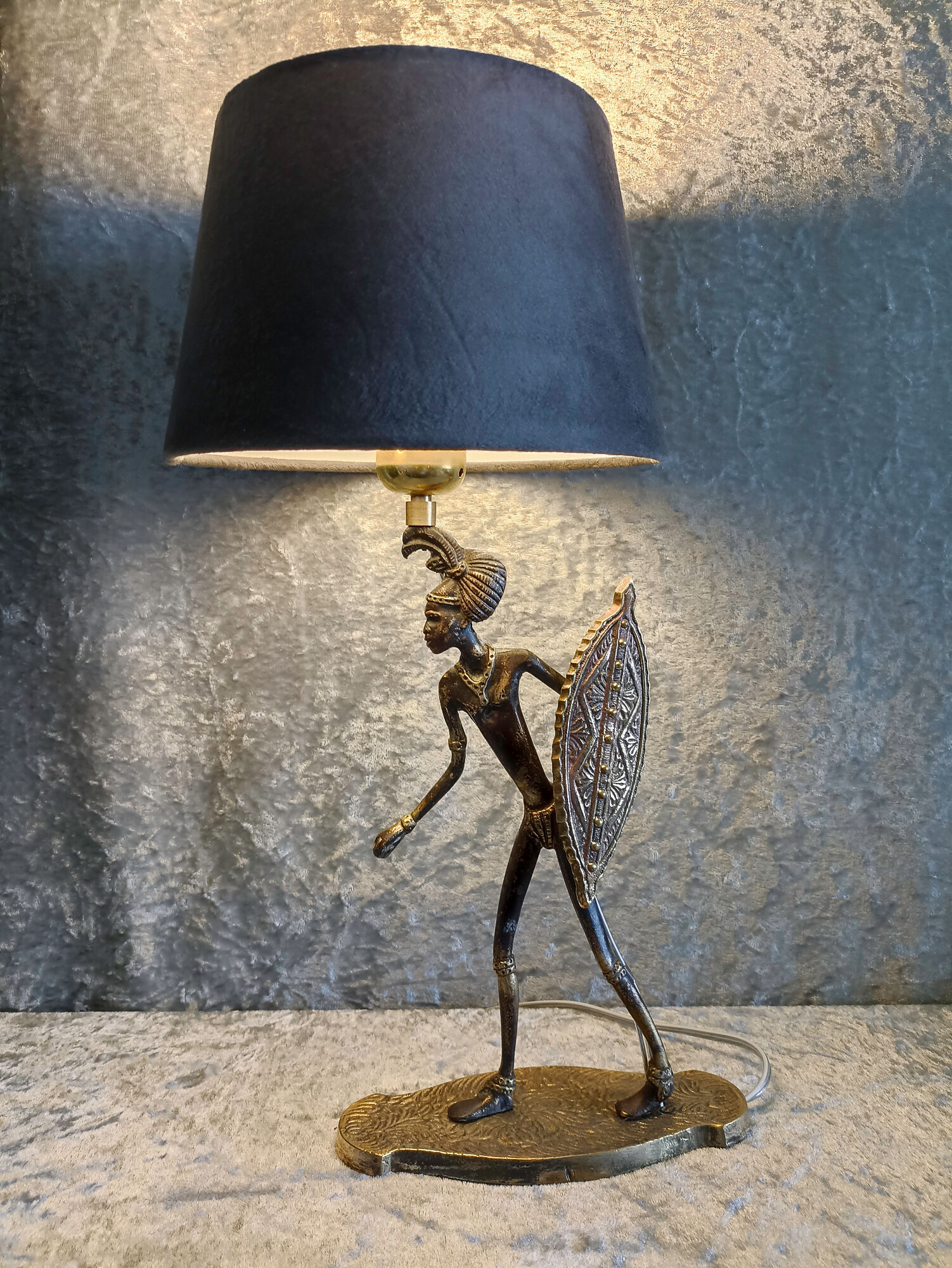 African warrior lamp in bronze.