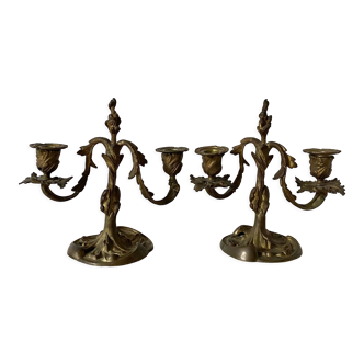 Pair of antique bronze candlesticks at the end of the table XIXth