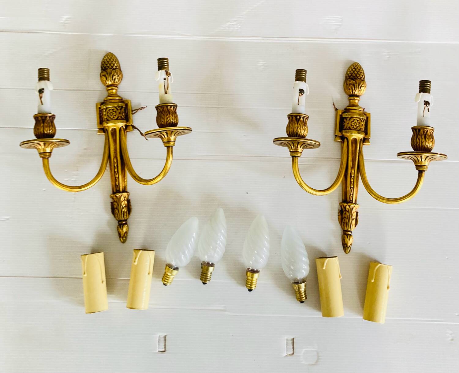 St Louis XVI gilded bronze wall lights with foliage and pine cone decorations