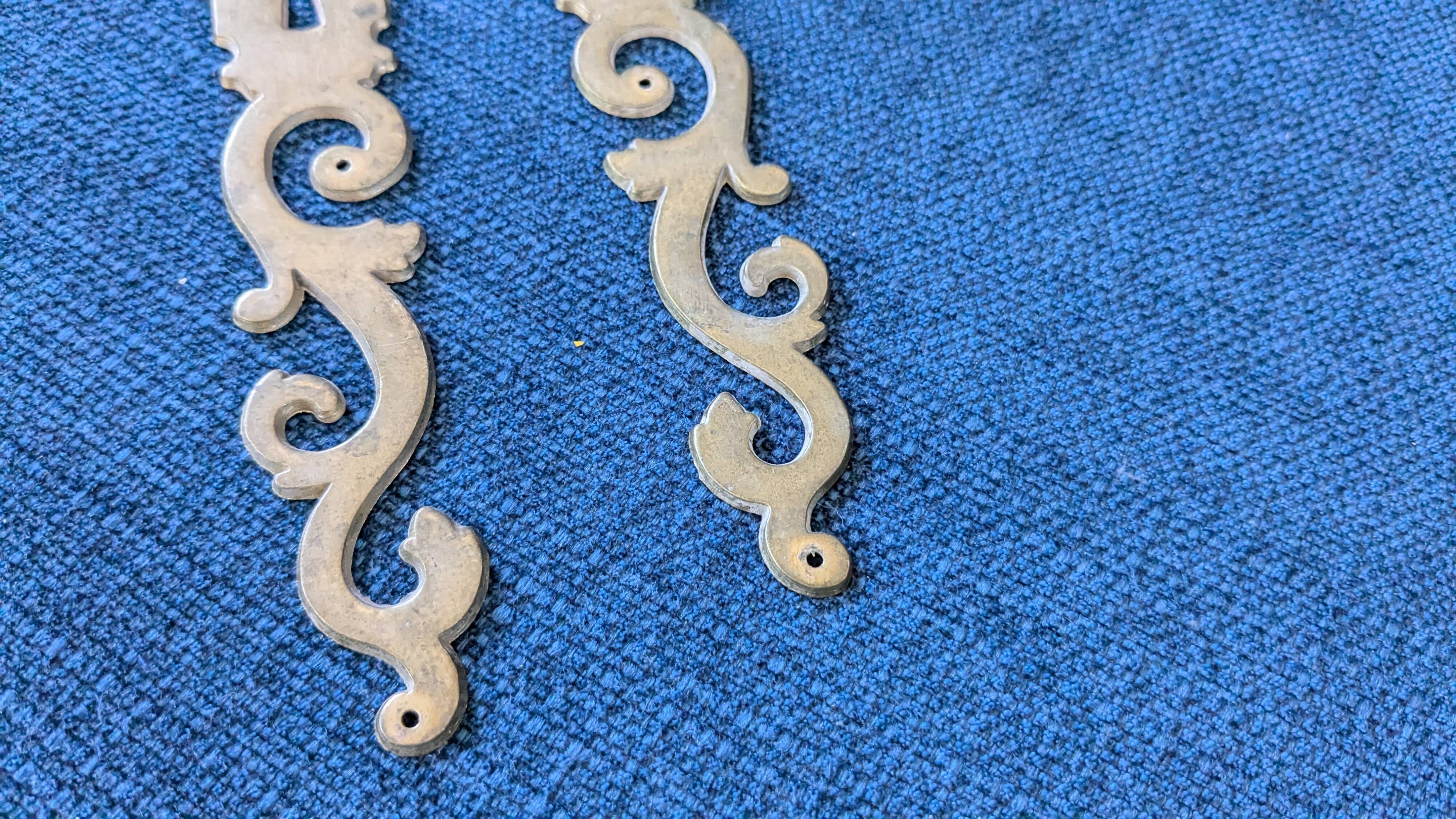 Pair of brass keyholes