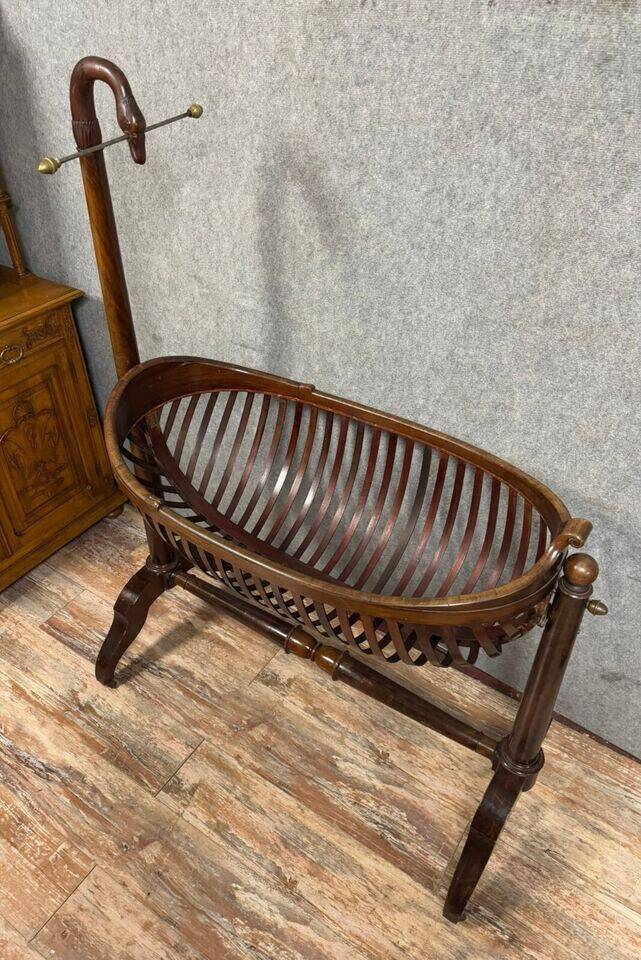 Empire style mahogany cradle with a swan neck, shaped like a cradle, circa 1810