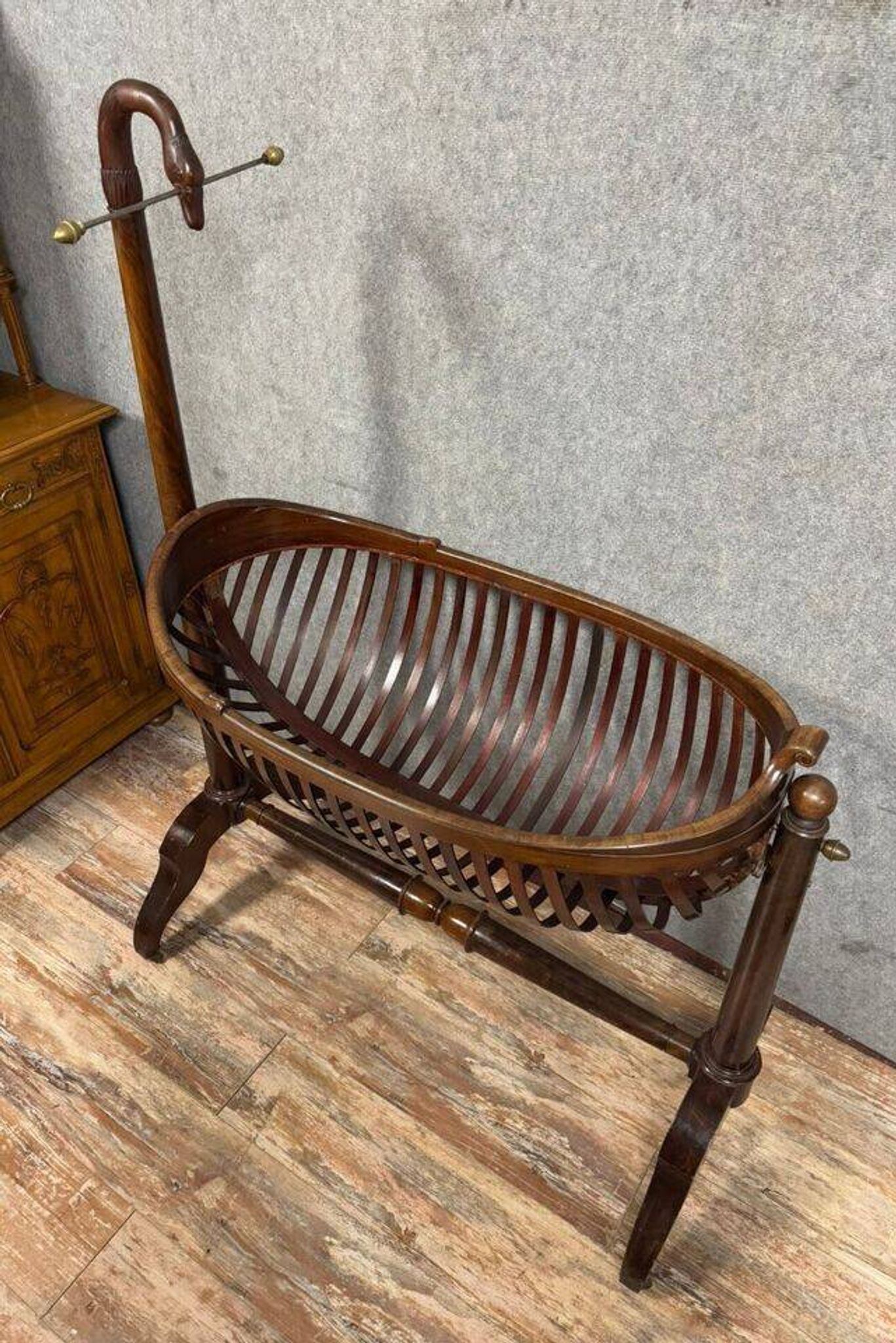 Empire style mahogany cradle with a swan neck, shaped like a cradle, circa 1810