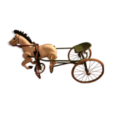 Old pedal horse with sulky