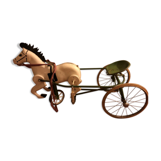 Old pedal horse with sulky