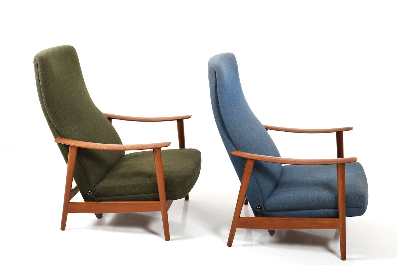 Pair of mid century Danish reclining lounge chairs in teak