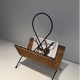Rattan and black lacquered metal magazine rack